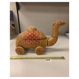 WOODEN CARVED CAMEL ON WHEELS 7IN H 8IN LONG