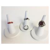 FOUR STERLING SILVER RINGS SIZES 3, 6 ,6.5 & 7