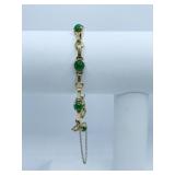 14K GOLD BRACELET W/ GREEN ROUND STONES 8.59