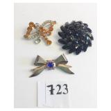 BLACK STONE DOME PIN BROOCH GOLD TONE BOW BLUE