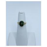 RING 10K SZ. 4 RING W/ GREEN STONE