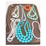 GROUP OF BEADED NECKLACES PLASTIC WHITW BROWN
