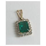 14K GOLD DIAMOND WITH EMERALD CENTER STONE IS