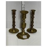 3 BRASS CANDLE STICKS, ONE LARGER THAN OTHERS