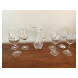 CLEAR GLASS PITCHER, 5 WINE GLASSES FROM STONE