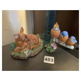 TWO PORCELAIN FIGURINES INCLUDING NESTLED IN