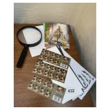 POSTAGE STAMPS AND MAGNIFYING GLASS