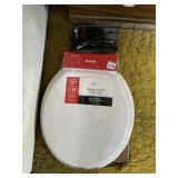 NEW TOILET SEAT AND CLOCK RADIO