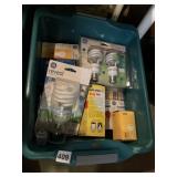 LARGE ASSORTMENT OF LIGHT BULBS IN STORAGE BIN
