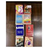 EIGHT DECKS OF PLAYING CARDS INCLUDING BRATS,
