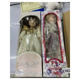 TWO PORCELAIN DOLLS ONE WITH FLOWER DRESS AND