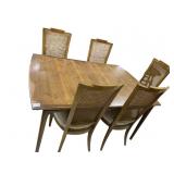 1960S PECAN DINING TABLE WITH FIVE CANE BACK