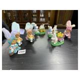 7 BUNNY DECORATIONS AND BUNNY IN CART