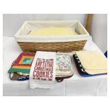 WOVEN BASKET FILLED WITH POTHOLDERS, PLACE MATS