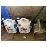 TWO ROUNDUP WEED AND GRASS KILLER AND A HAND