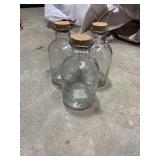 THREE GLASS JARS WITH CORK LIDS