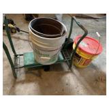 GARDEN KNEELING BENCH EMPTY BUCKETS AND PLANT