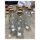 TEN GLASS BOTTLES WITH CORK LIDS