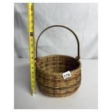 SIGNED BOTTOM HANDLED WOVEN BASKET