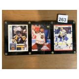 THREE MARIO LEMIEUX CARDS IN HOLDER