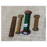 FOUR SPOOLS RANGING IN HEIGHT FROM 4 AND 3