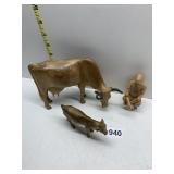 WOULD ANIMALS AND CROSS-LEGGED FIGURE