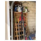 CONTENTS OF CORNER OF GARAGE BROOMS AND SHEPARDS
