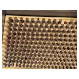 BOARD FULL OF TEST PIECES FOR CHECKING MACHINED