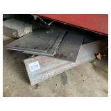 PIECES OF ANGLED METAL UNDER TOOLBOX
