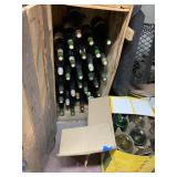 WOOD CRATE FILLED WITH BOTTLES THAT ARE FULL AND