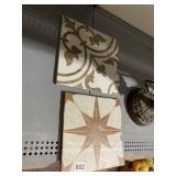 TWO DECORATED CERAMIC TILES