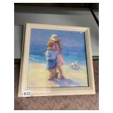 TWO CHILDREN AT THE BEACH WITH PUPPY DOG