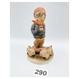 HUMMEL, BOY WITH PIGS, MFG. FLAW ON BACK OF FOOT