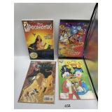 4 DISNEY COMIC BOOKS IN PROTECTORS