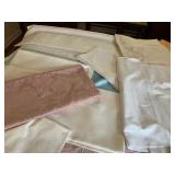 VARIETY OF TABLE LINENS INCLUDING PIERCED DETAIL