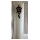CUCKOO CLOCK WITH MUSICIANS ON FRONT IN WORKING
