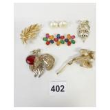 PIN GROUP SWAN WITH RED BODY GOLD TONE FLOWER BAR