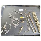 BRACELETS GOLD TONE AVON PURPLE STONES POODLE PIN