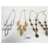 FOUR STATEMENT NECKLACES YELLOW BROWN WHITE