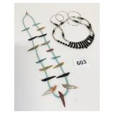 STRING OF BLUE BEADS WITH CARVED STONE BIRD