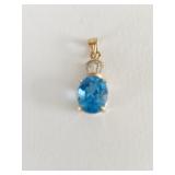 BLUE TOPAZ PENDANT SET IN 18K GOLD W/3 CZ ACCENT