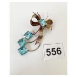 STERLING BY JORDAN BOW PIN WITH SQUARE BLUE STONE