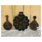 CAST IRON TRIVETS AND HEART SHAPE PAN