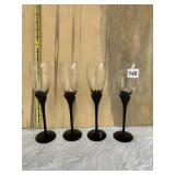 4 CHAMPAGNE GLASSES WITH BLACK APPLIED STEMS