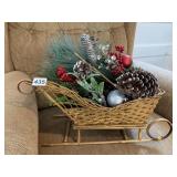 WICKER SLEIGH WITH GREENERY