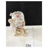 VINTAGE PORCELAIN CHERUB WITH CRACKED EGG 6" H