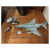 MODEL FIGHTER PLANE AND THREE TOY TRUCKS