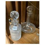 TWO NICE GLASS DECANTERS WITH TOPPERS