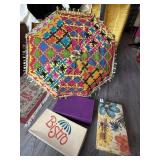 EMPTY VINTAGE SHOE BOXES AND COLORFUL PARASOL
