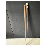 2 CANES, ONE IS WOOD, 0NE IS COMPOSITION